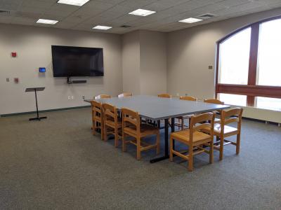 Large meeting room with video conferencing equipment