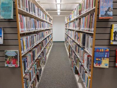 Aisle of book shelves